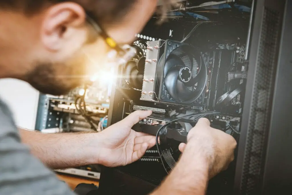 A person Removing Graphics Card from a PC